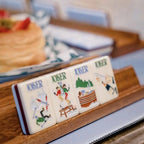 Hand holds illustrated mahjong tile
